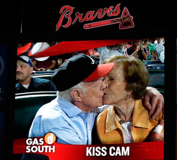 Carter smooches wife