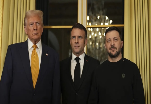 Trump is welcomed by Macron to Paris with presidential pomp and joined by Zelenskyy for their talks